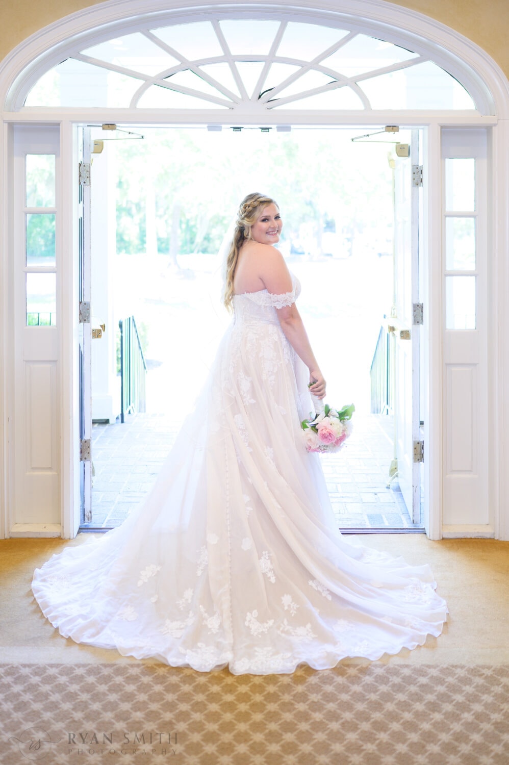 Portraits of bride in the light from the doorway - Pawleys Plantation