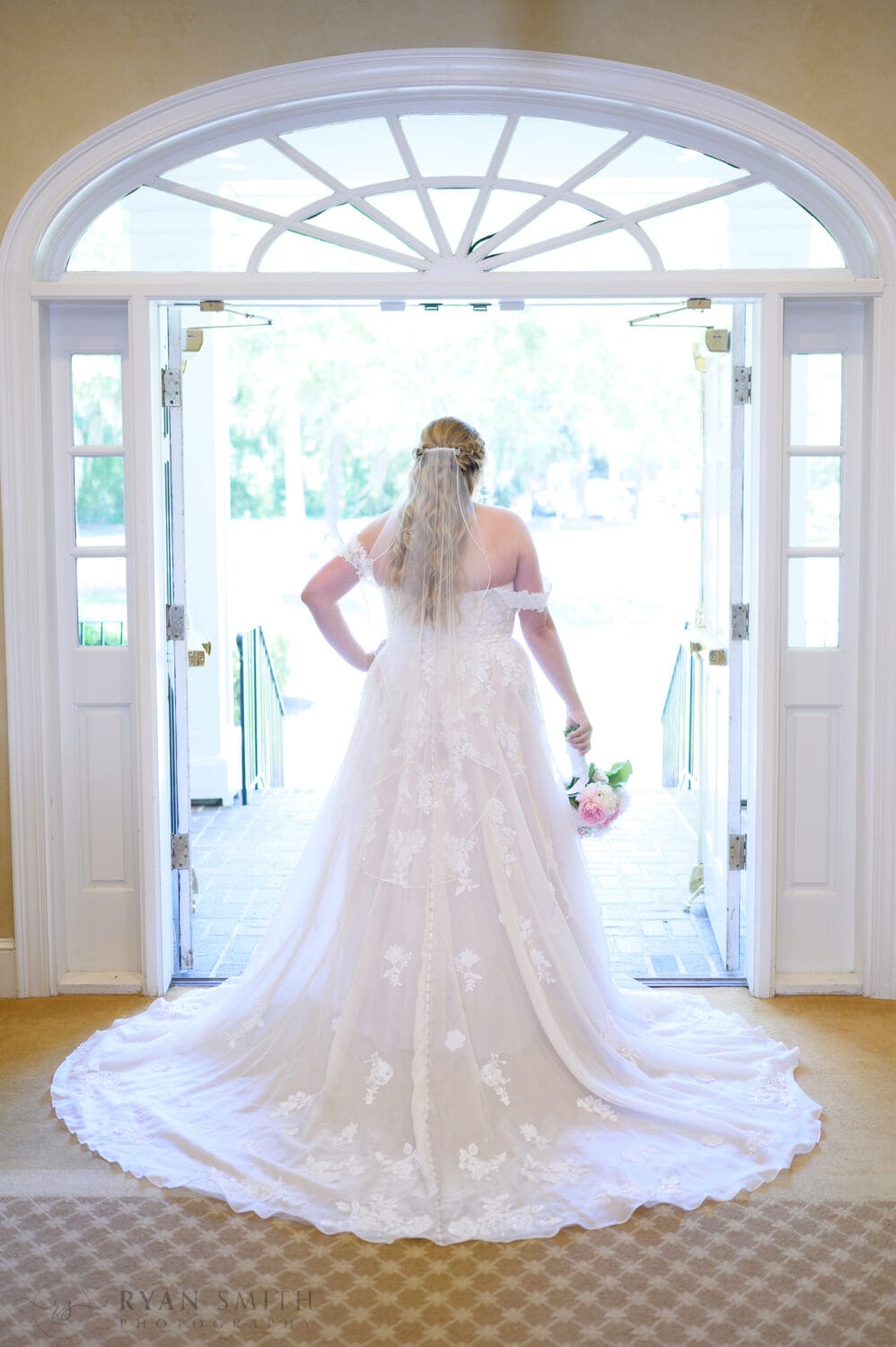 Portraits of bride in the light from the doorway - Pawleys Plantation