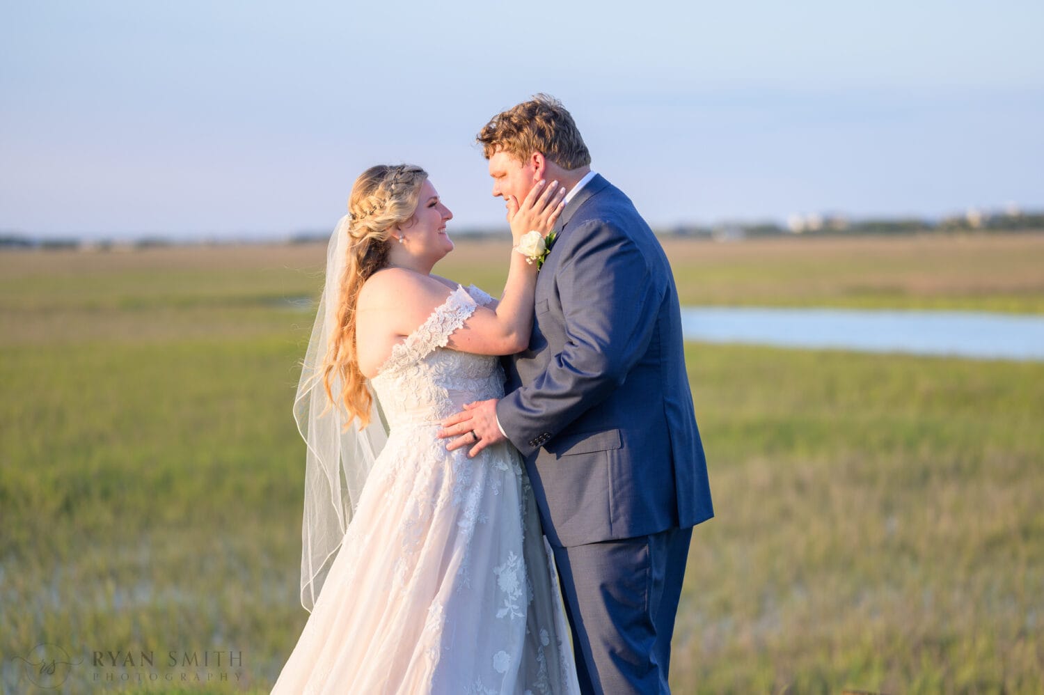Portraits with the bride and groom on the marsh out on the golf course - Pawleys Plantation