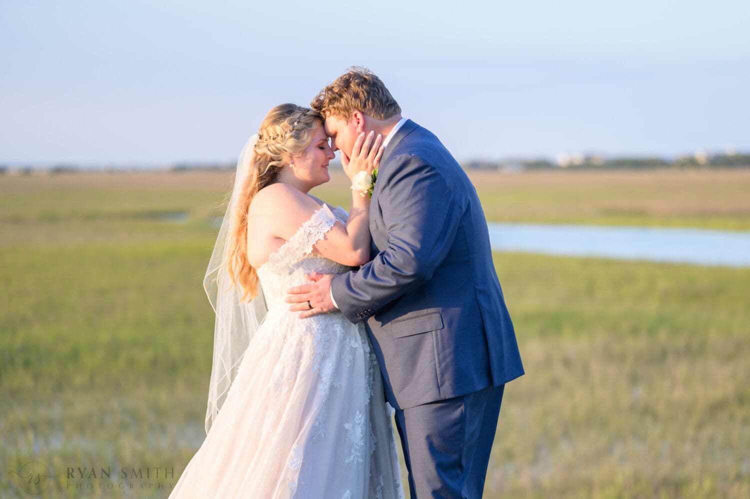 Portraits with the bride and groom on the marsh out on the golf course - Pawleys Plantation