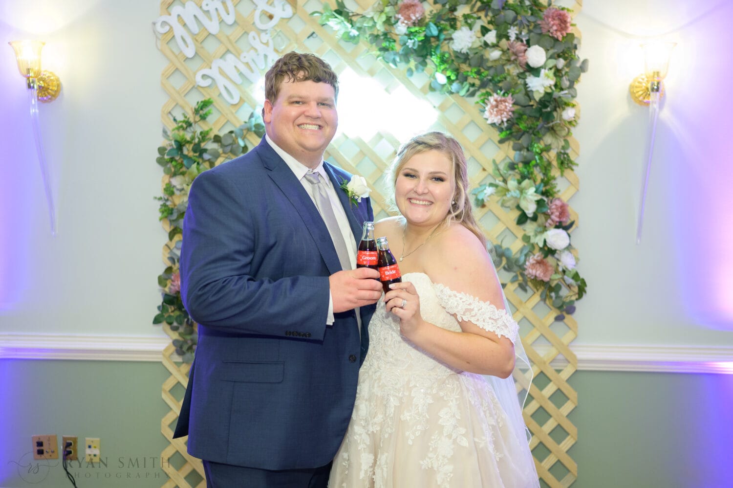 Toasts with the bride and groom coke bottles - Pawleys Plantation