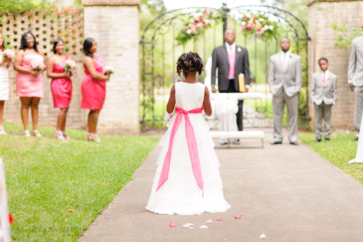 Wedding ceremony by the wrought iron gates on the Oak Allee  - Brookgreen Gardens, Murrells Inlet, SC