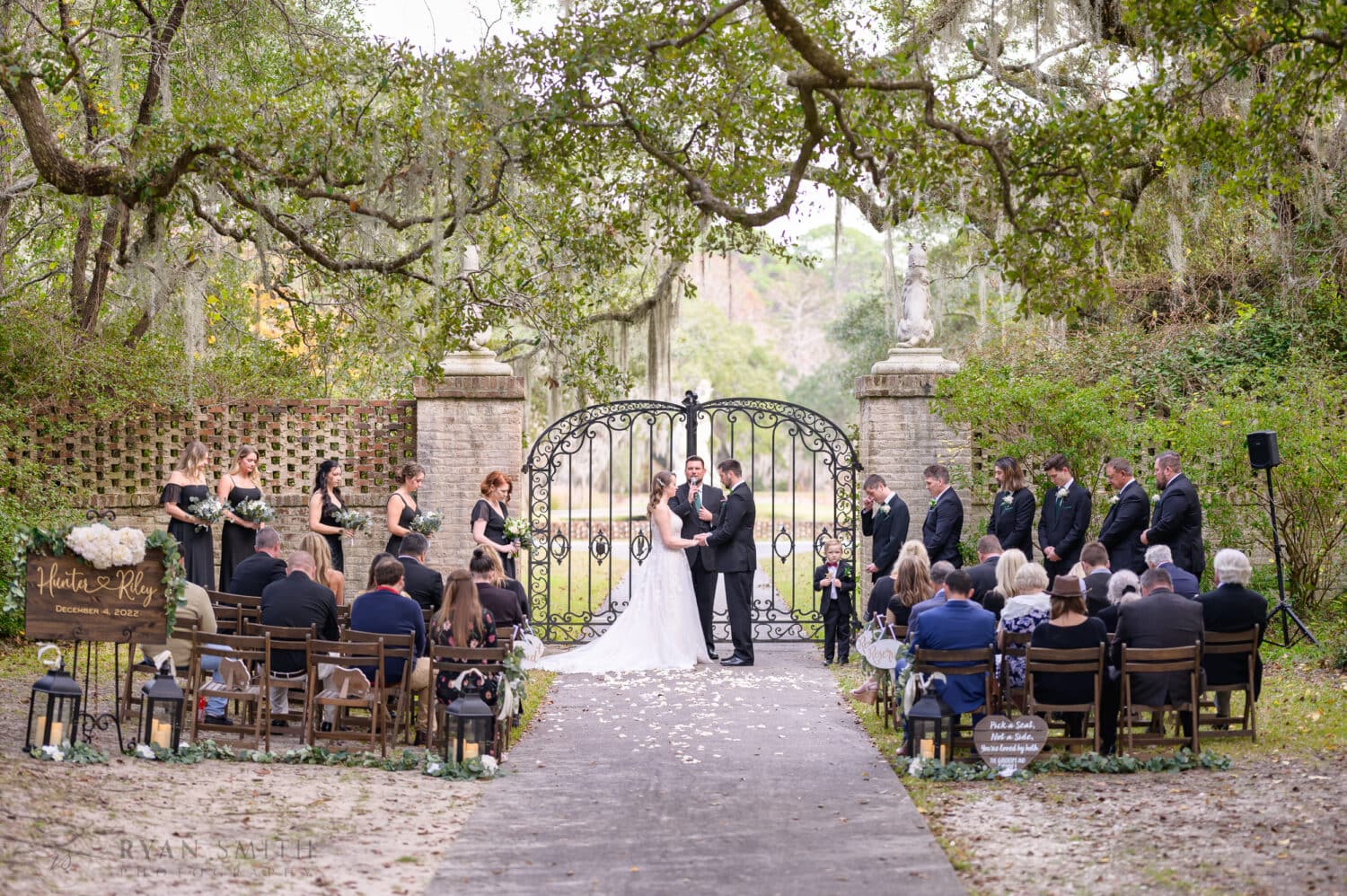 Wide angle of the ceremony by the iron gates - Brookgreen Gardens