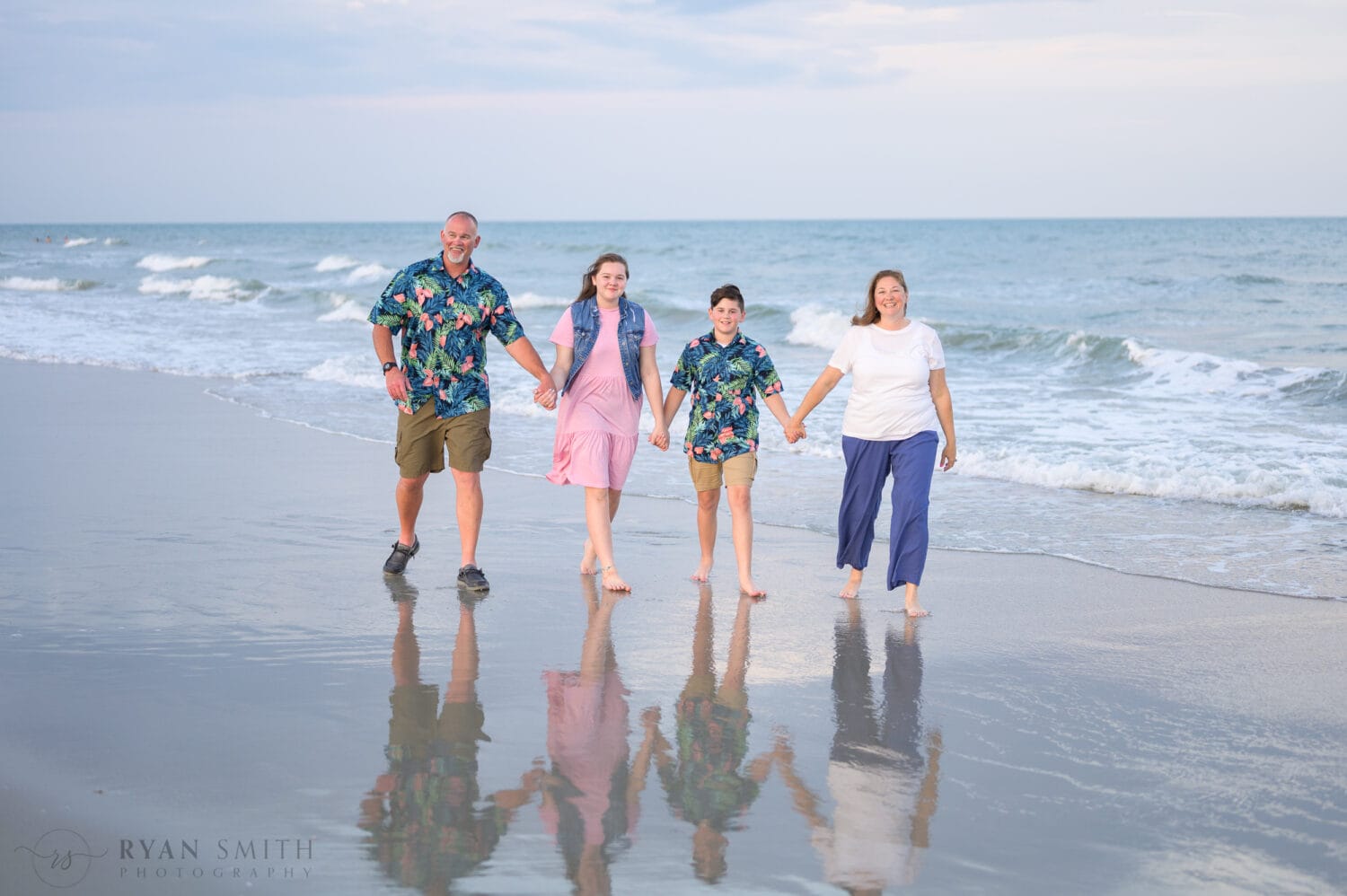 Big family group having fun with portraits on the beach - Huntington Beach State Park
