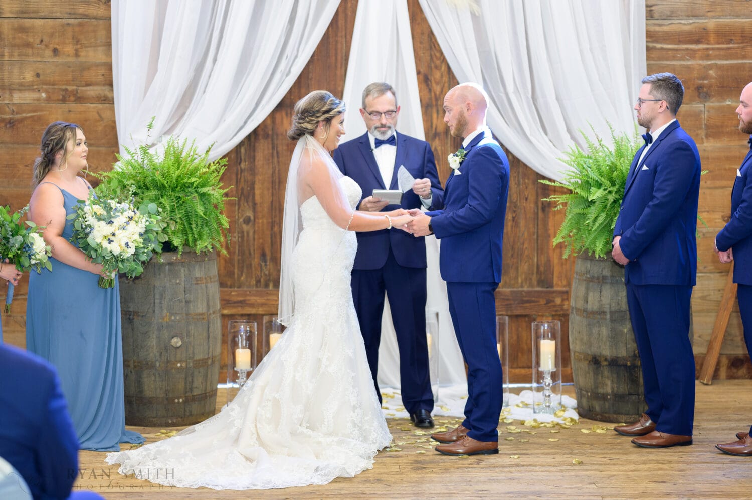 Bride and groom during the ceremony - The Peanut Warehouse - Conway
