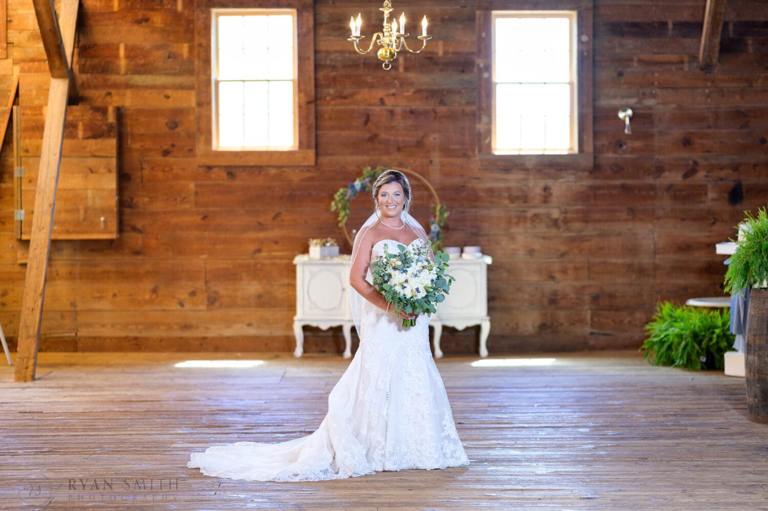 Bride standing in the window light - The Peanut Warehouse - Conway
