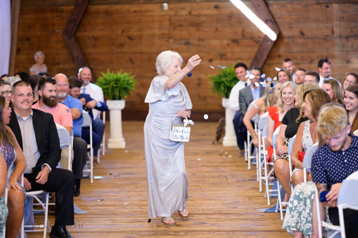 Cute flower grannies throwing the petals walking down the aisle - The Peanut Warehouse - Conway