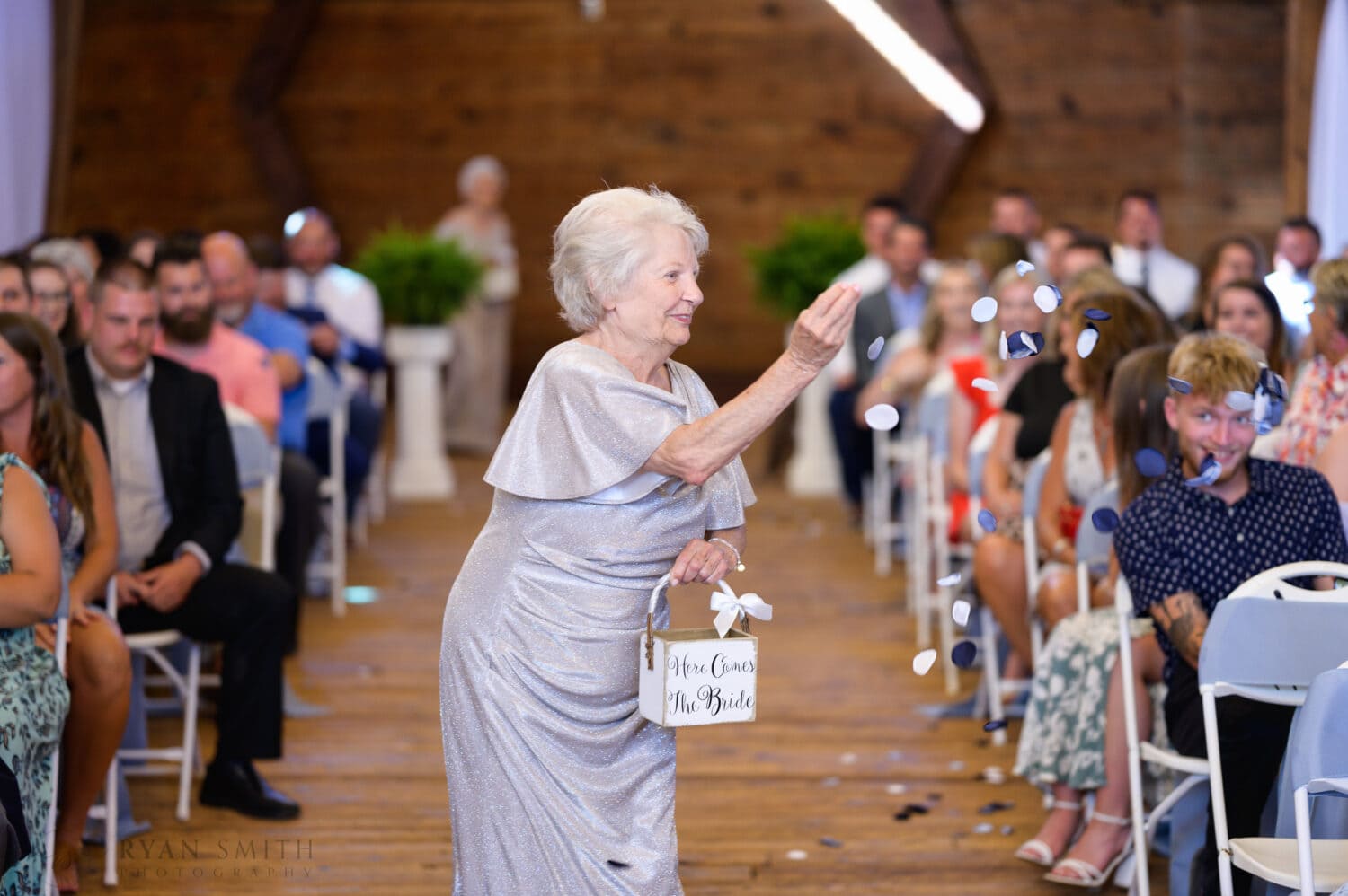 Cute flower grannies throwing the petals walking down the aisle - The Peanut Warehouse - Conway