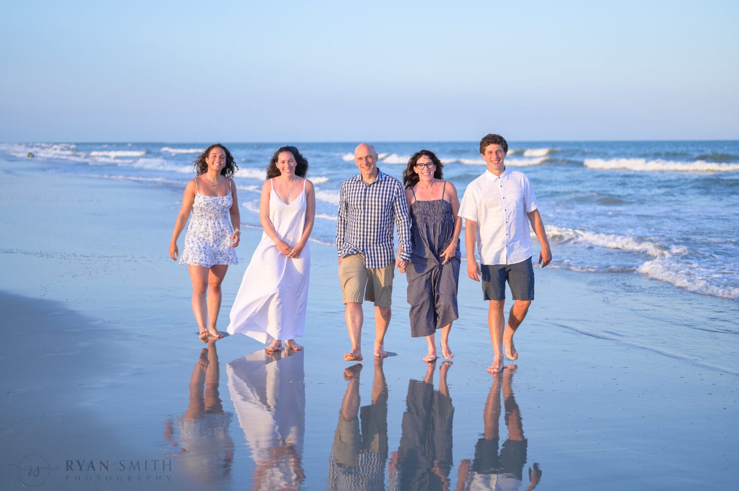 Mom and dad with their adult children on the beach - Huntington Beach State Park