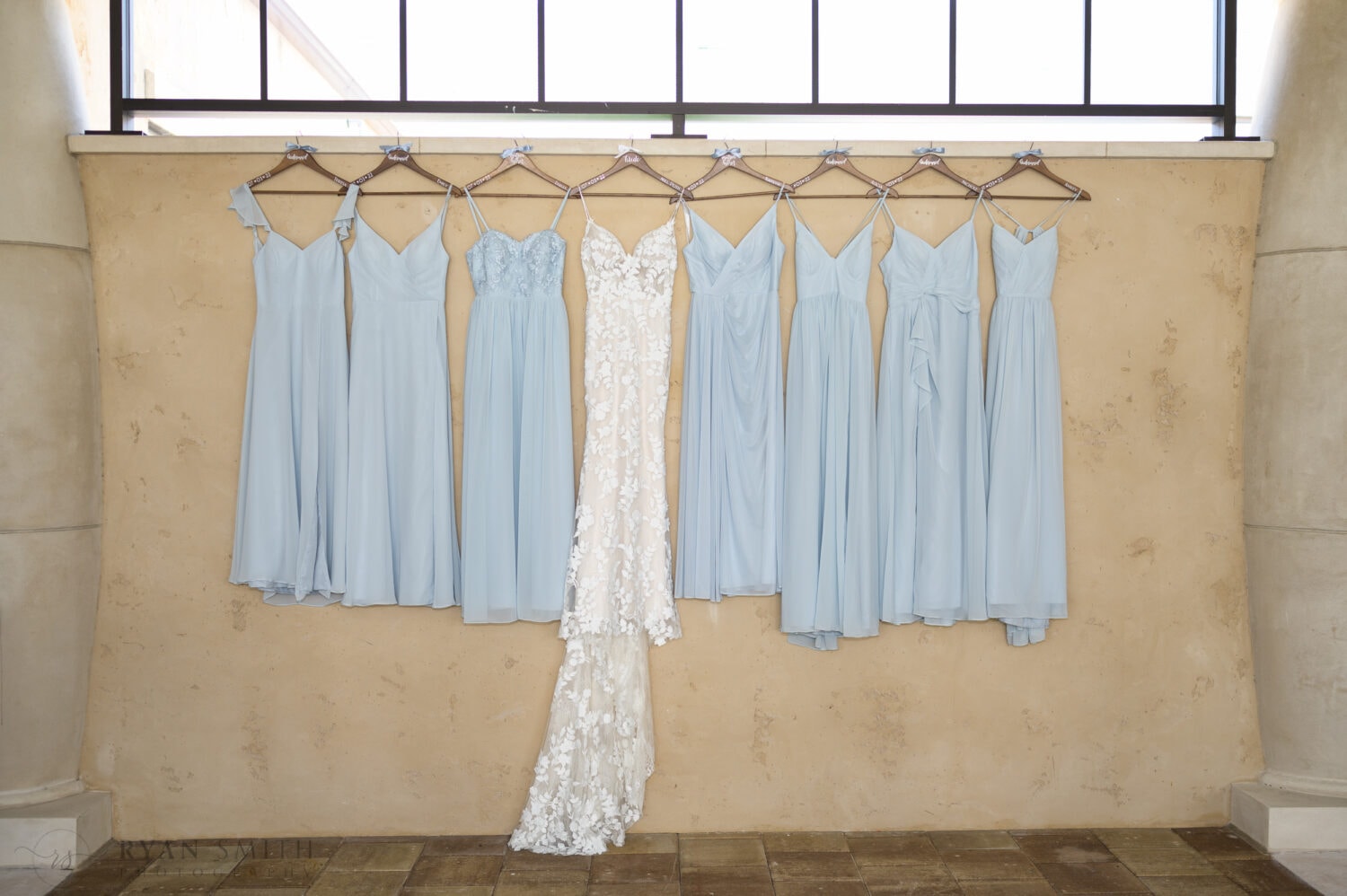 Bride and bridesmaid dressing hanging in the courtyard - 21 Main Events