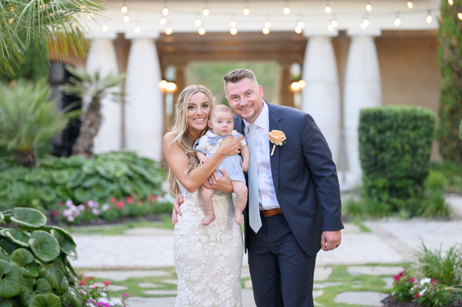 Bride and groom holding baby nephew - 21 Main Events