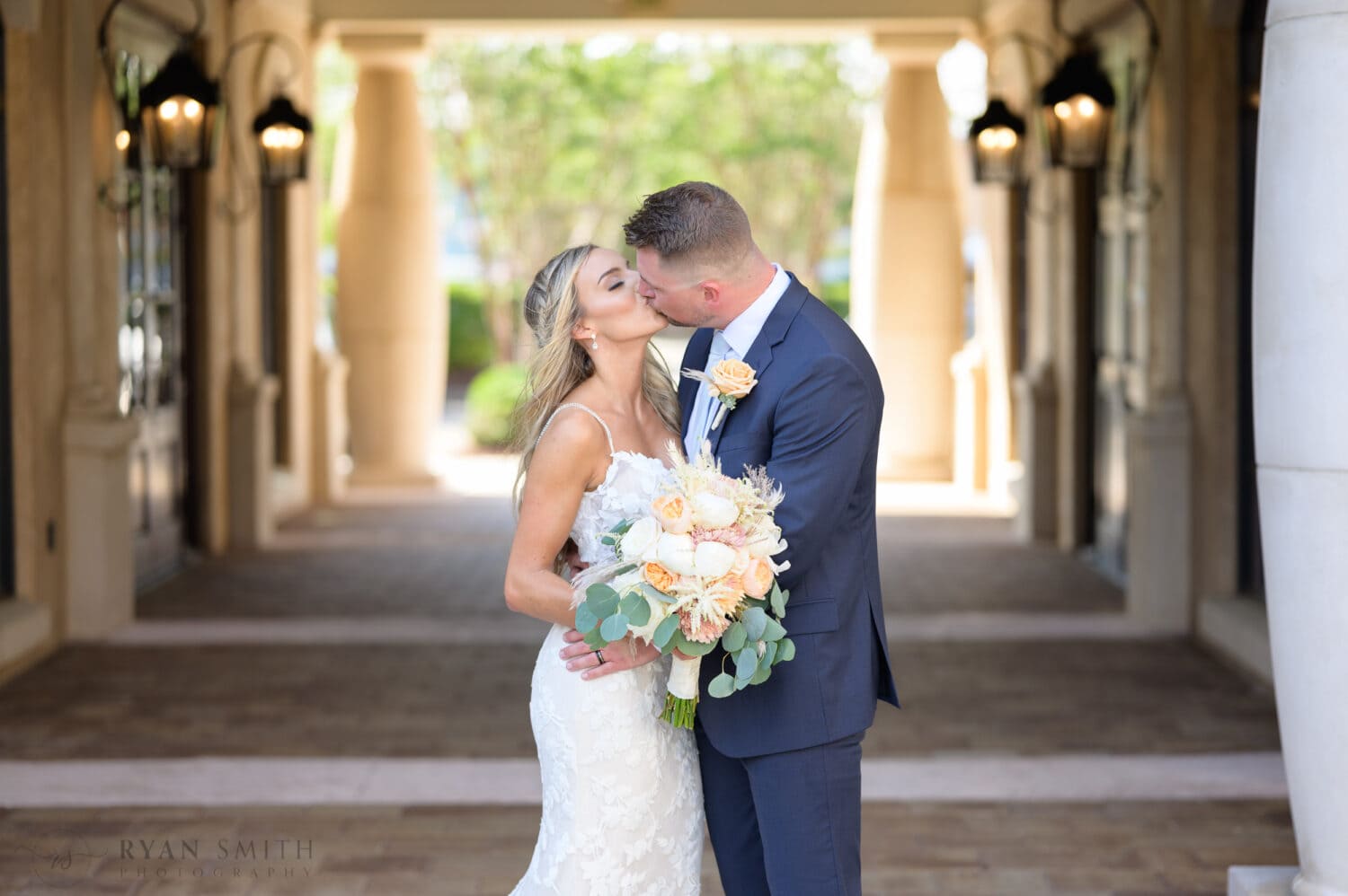 Bride and groom portraits in the shade of the courtyard walkway - 21 Main Events