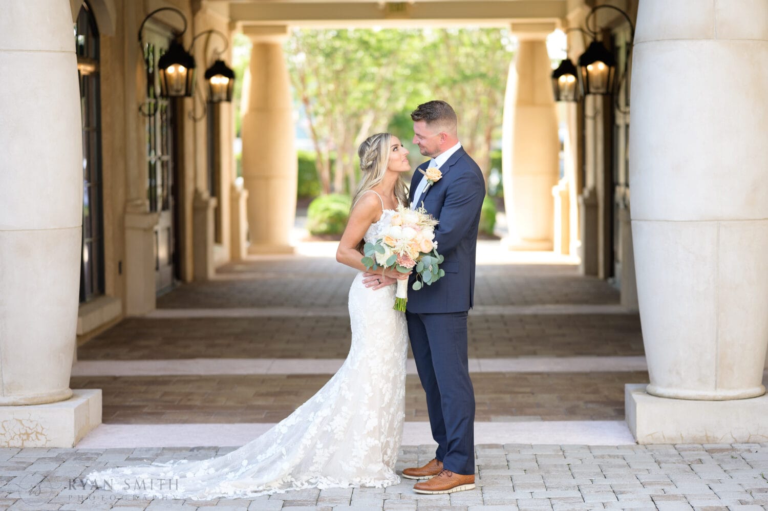 Bride and groom portraits in the shade of the courtyard walkway - 21 Main Events