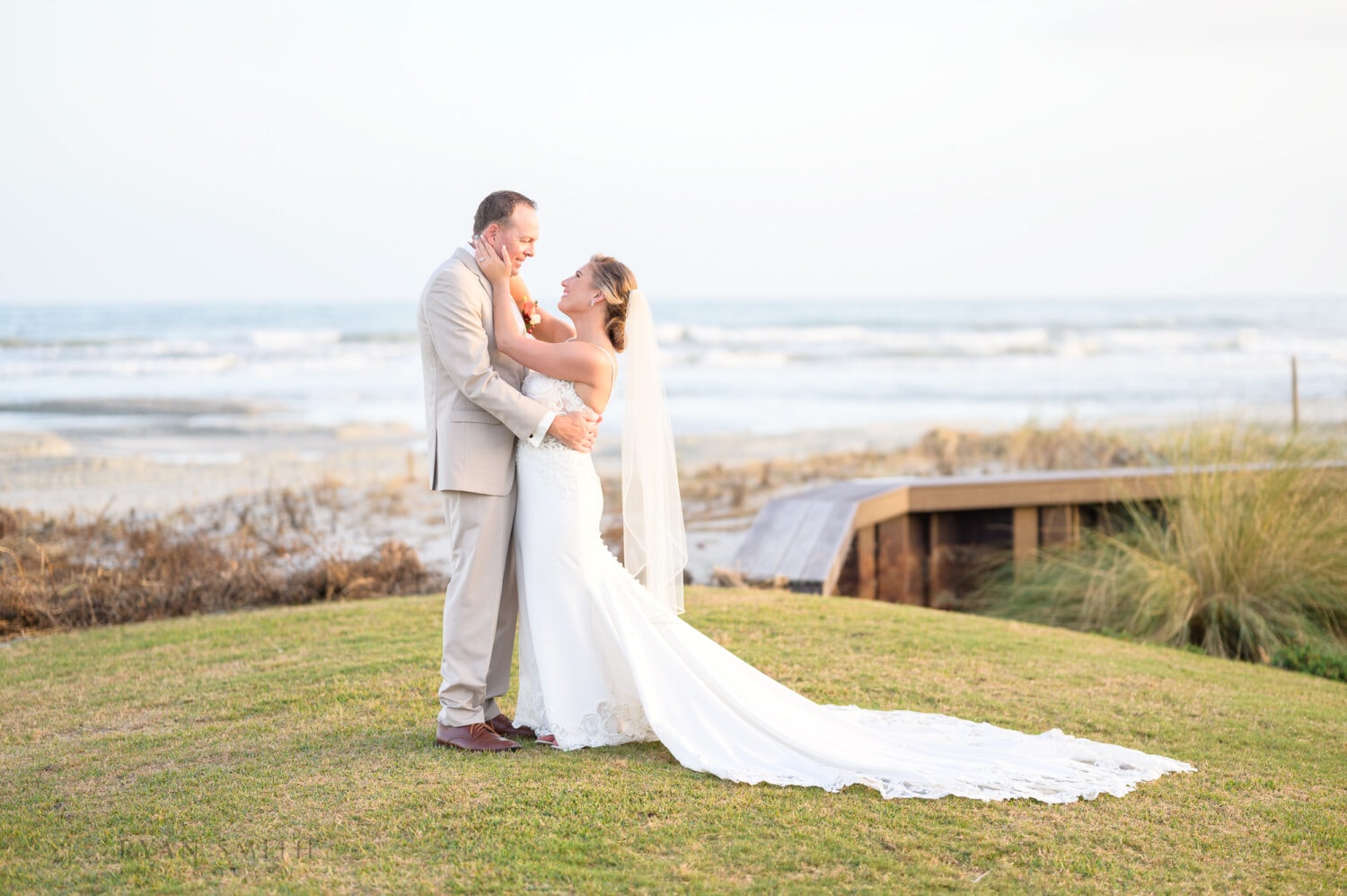 Bride touching grooms face - Dunes Golf & Beach Club