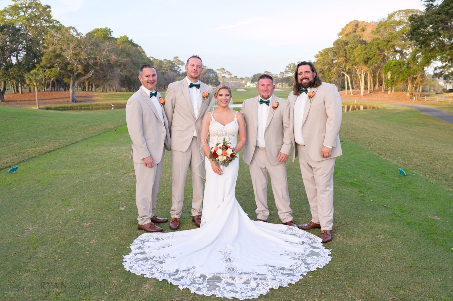 Bride with the groomsmen - Dunes Golf & Beach Club