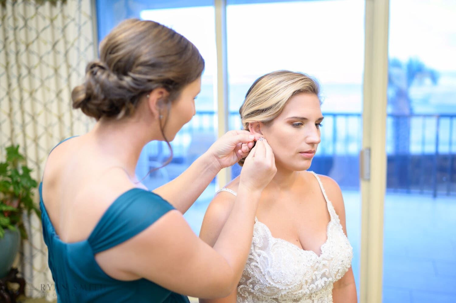 Bridesmaids helping bride get ready - Dunes Golf & Beach Club