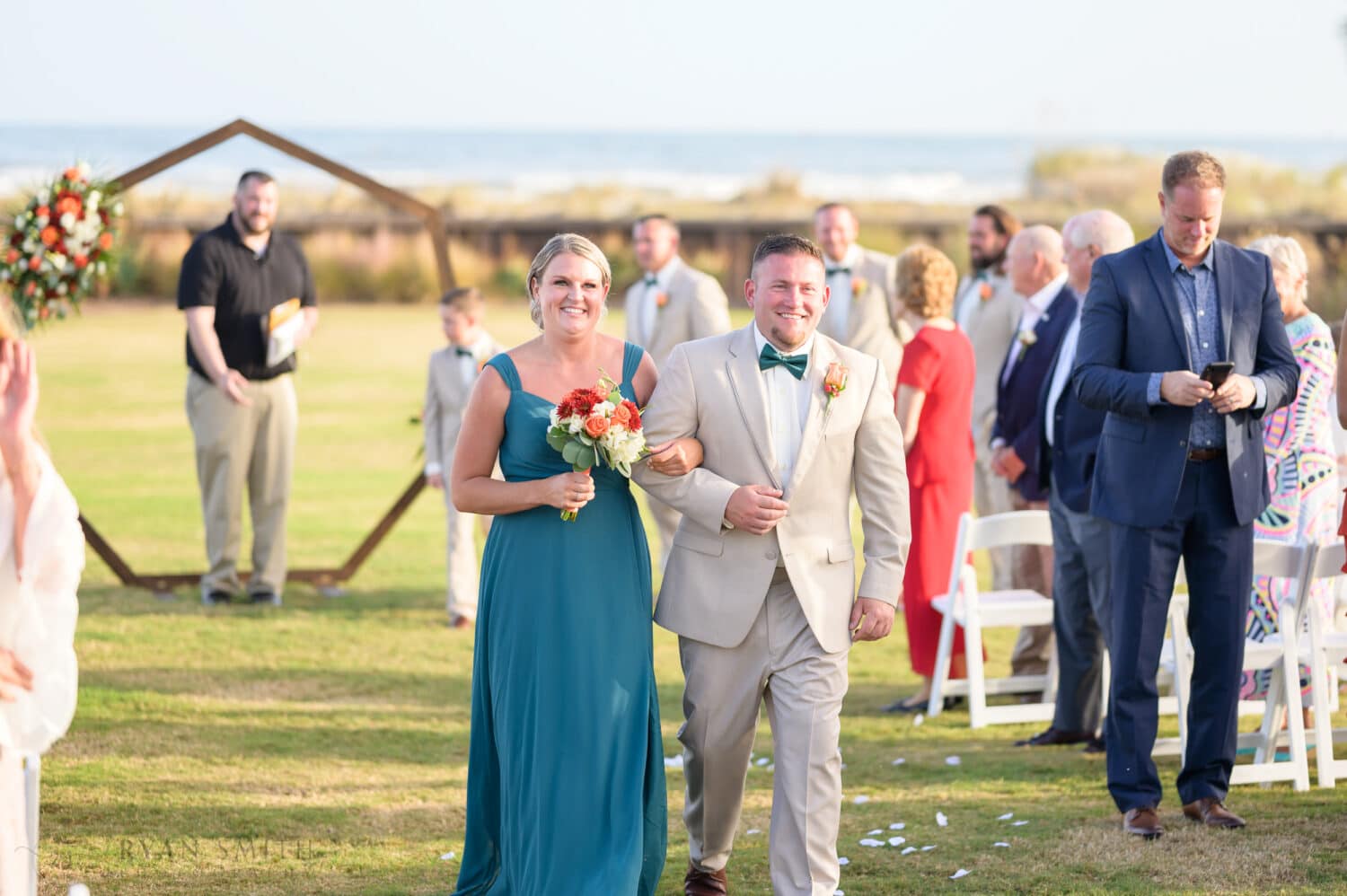 Wedding party walking from the ceremony - Dunes Golf & Beach Club