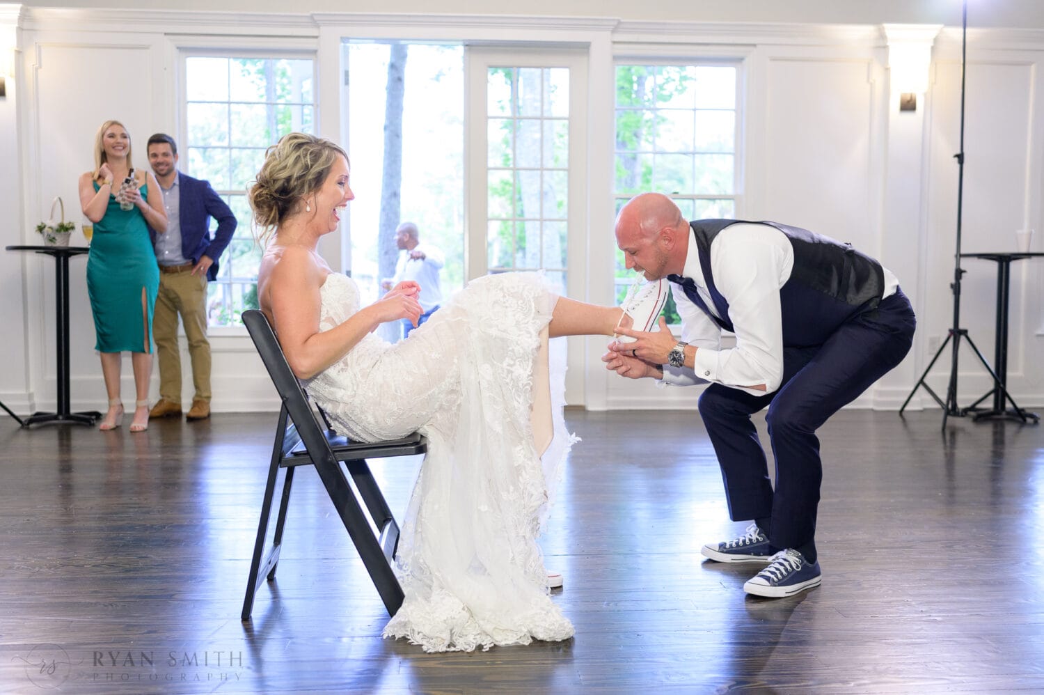 Groom taking off the garter - The Village House at Litchfield