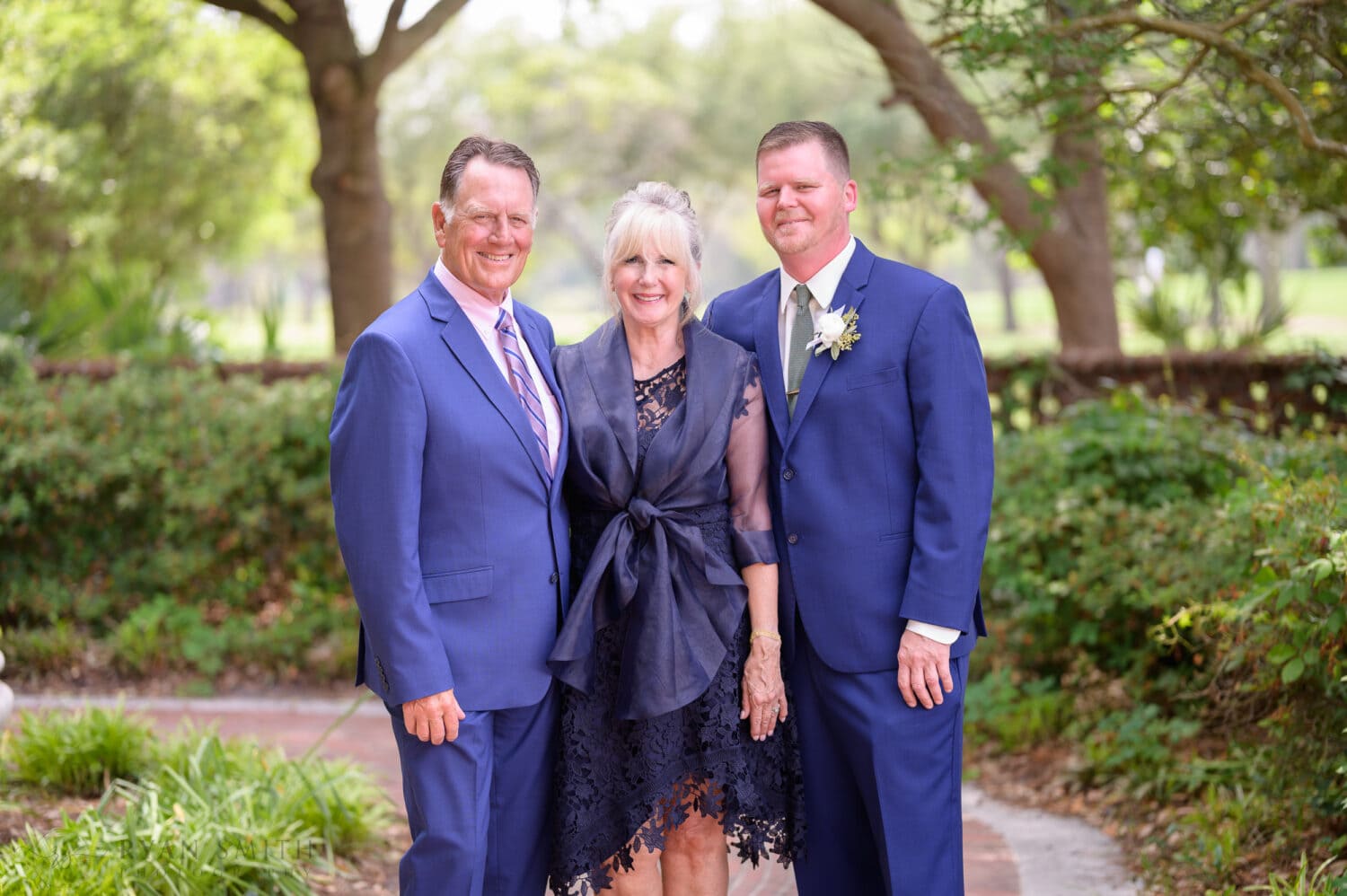 Groom with his parents - Pine Lakes Country Club