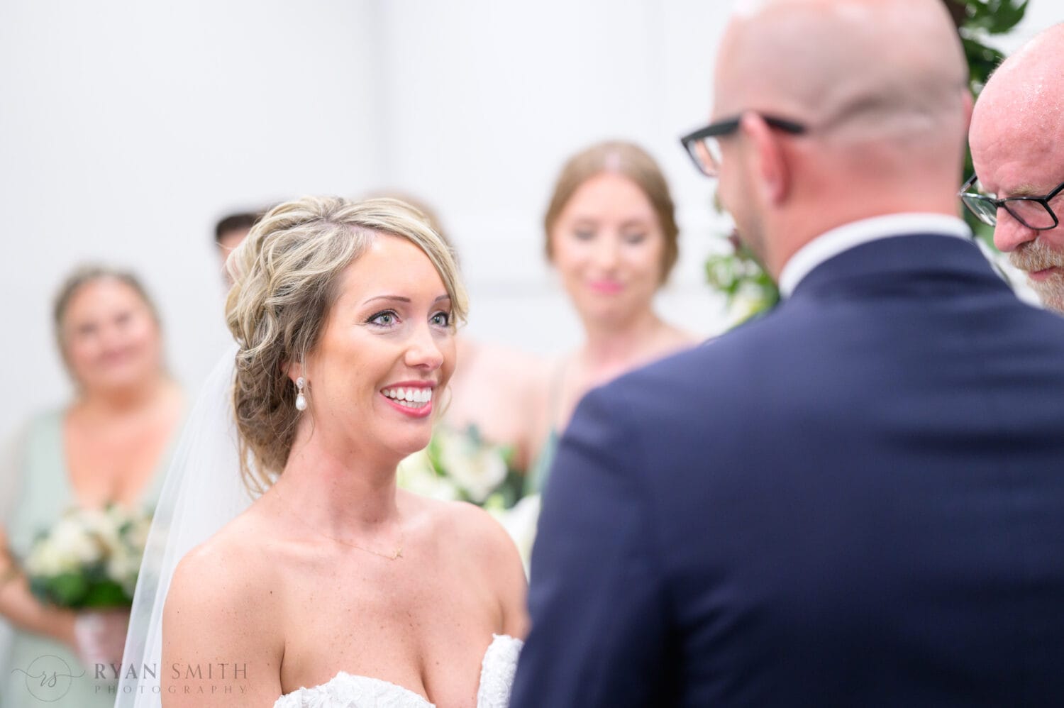Happy bride during the ceremony - The Village House at Litchfield