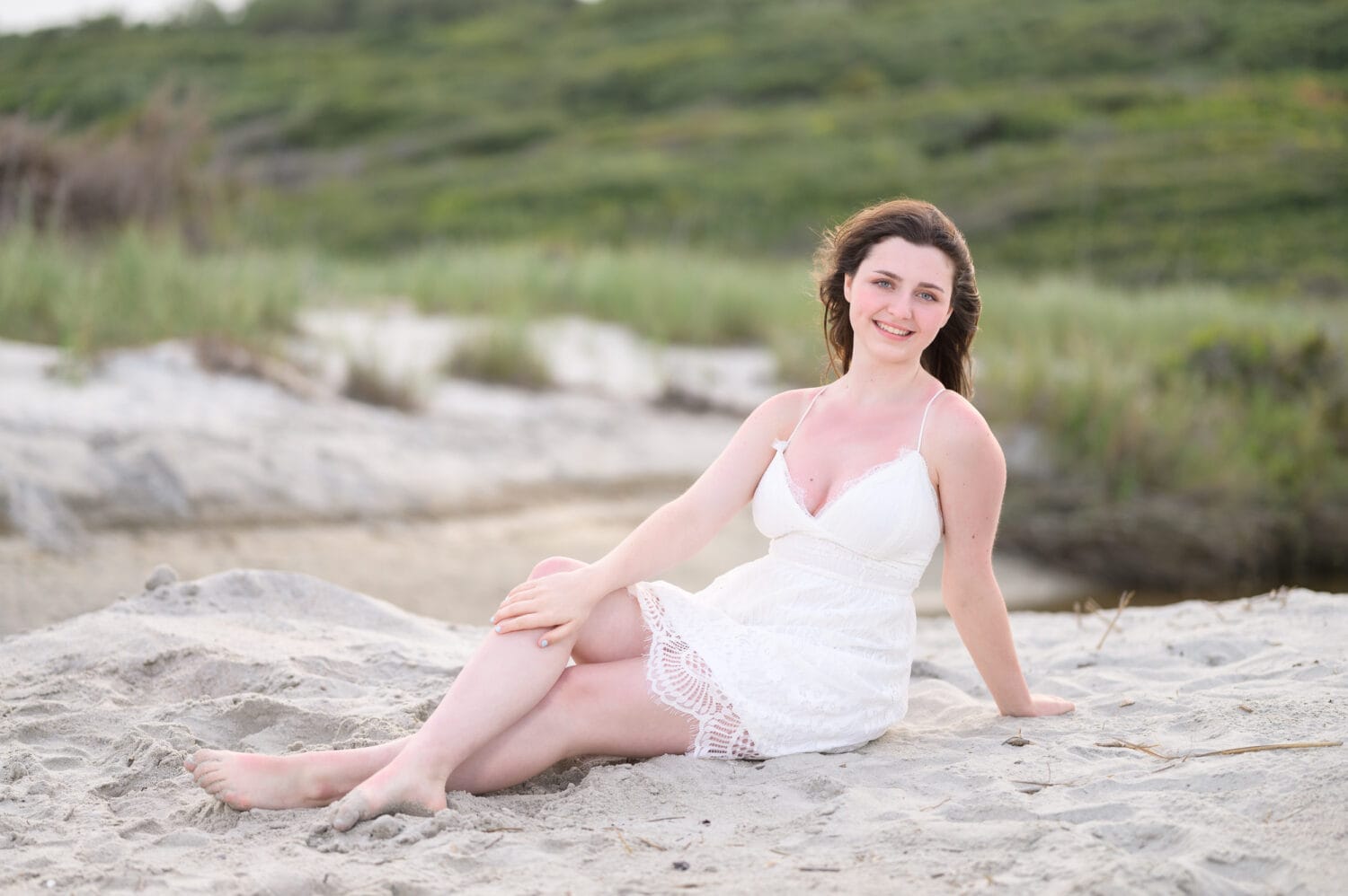 Senior portrait laying in the sand - Myrtle Beach State Park