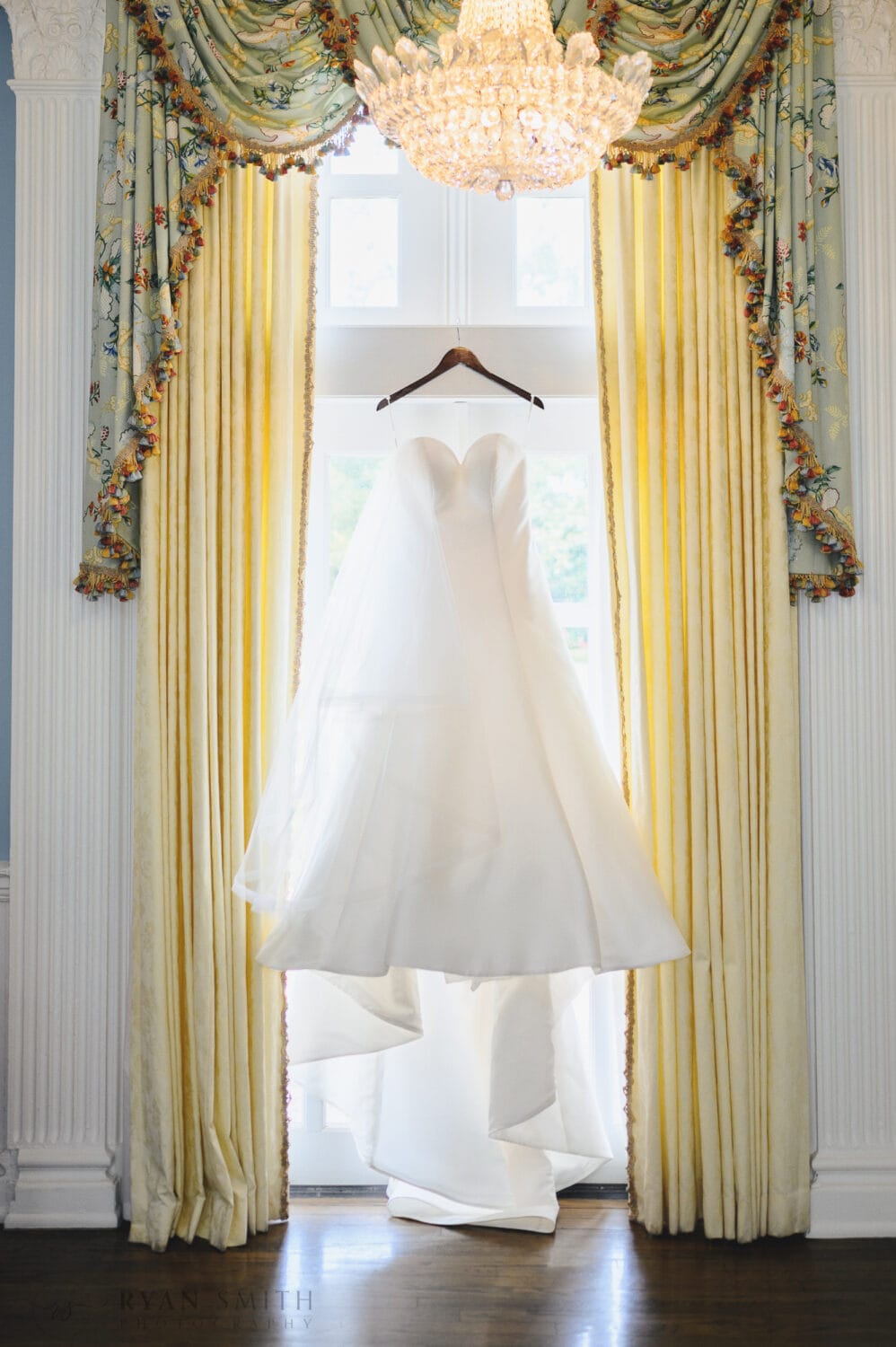 Wedding dress hanging in the window - Pine Lakes Country Club