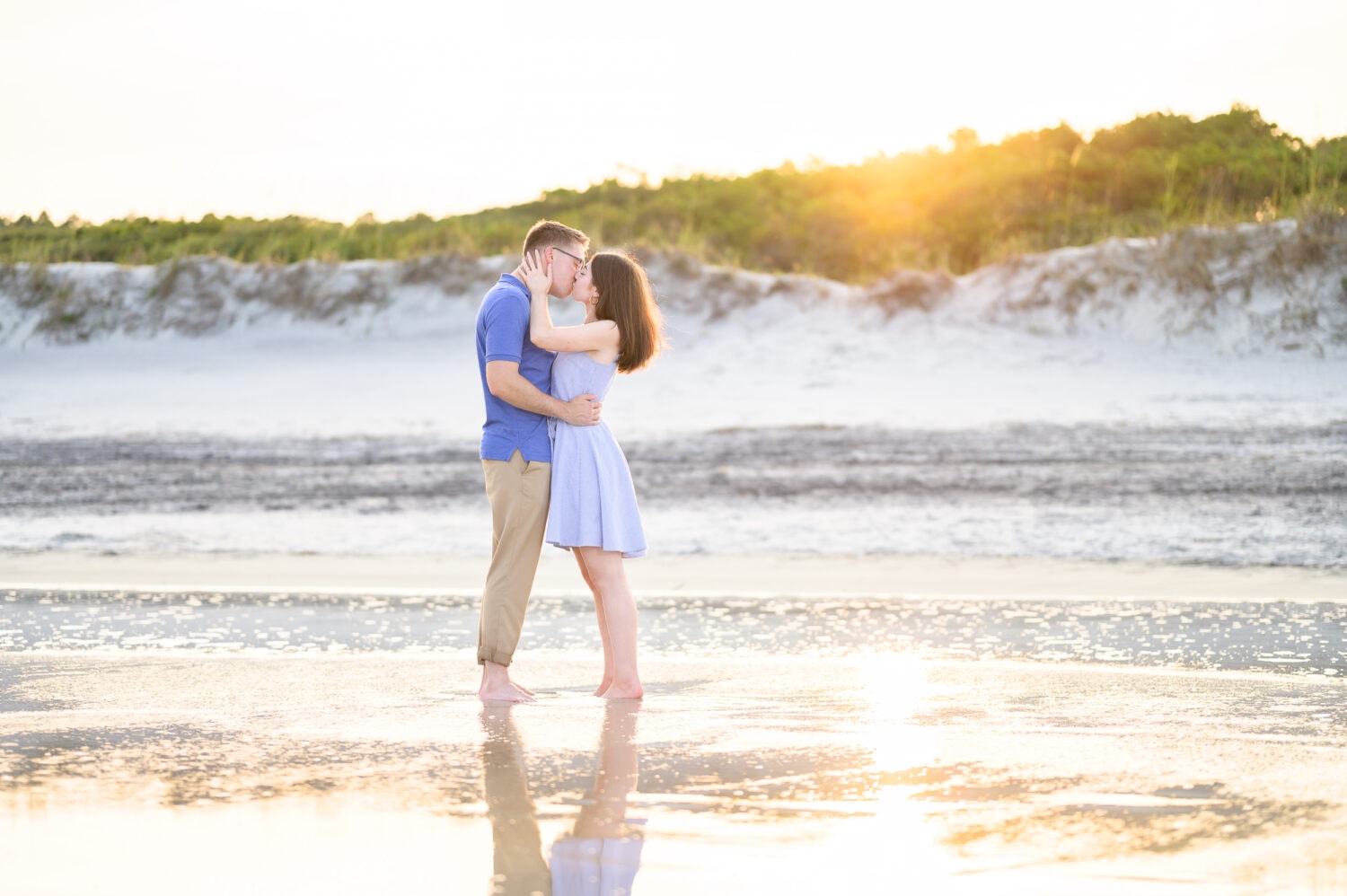 Sunset reflecting in the water for a kiss after the surprise proposal - Huntington Beach State Park