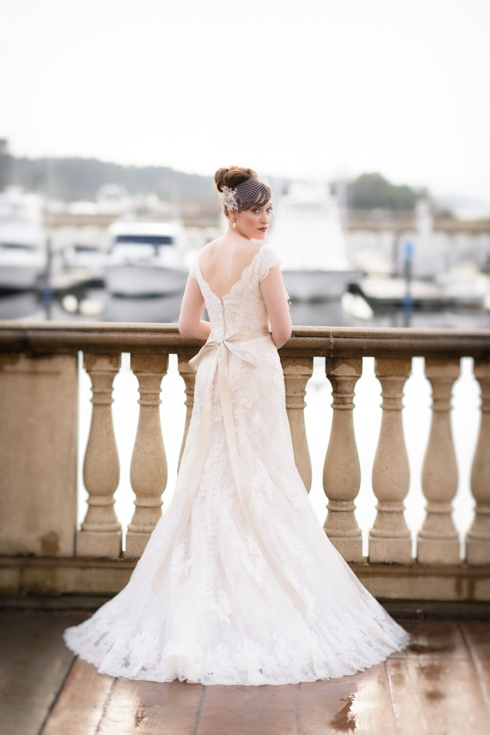 Bride standing in front of the harbor looking back - Marina Inn, Myrtle Beach