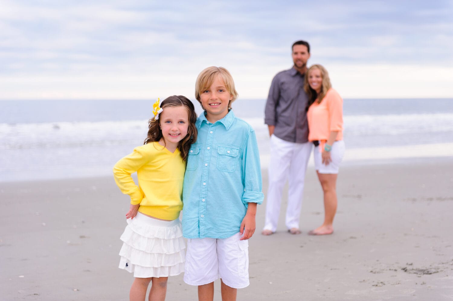 Family in the background of little brother and sister - Myrtle Beach State Park