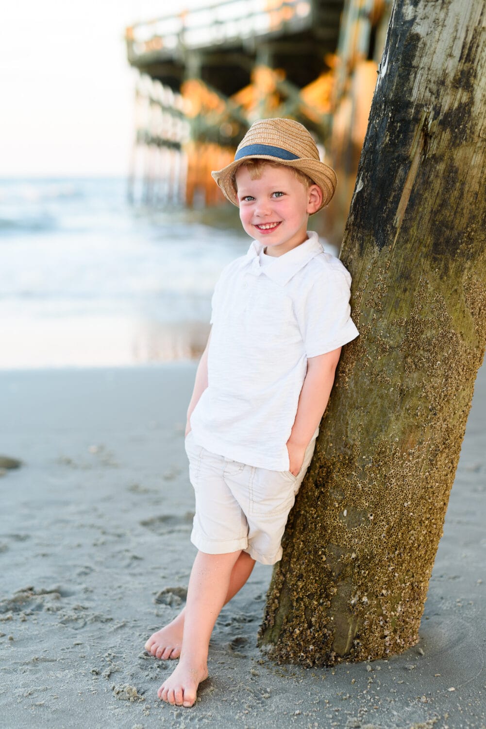Happy boy standing by the pier - Cherry Grove Pier