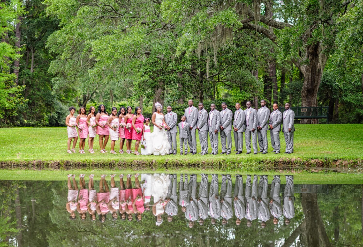 Large bridal party reflecting in a lake - Brookgreen Gardens