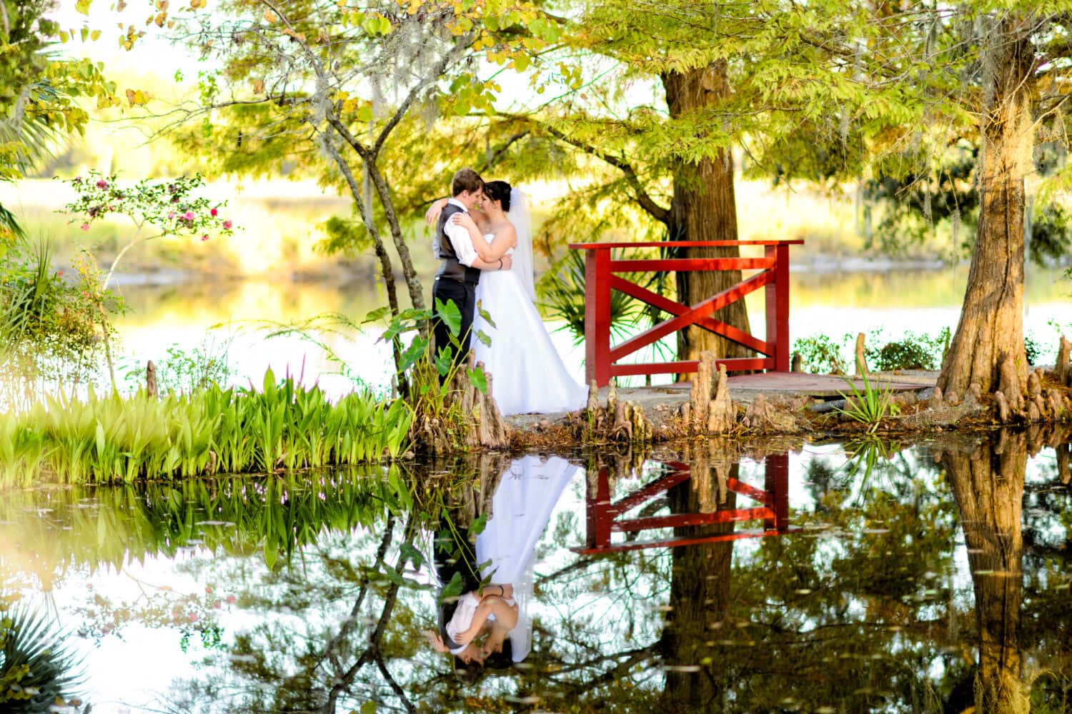 Portrait of bride and groom with reflection in the lake - Magnolia Plantation, Charleston