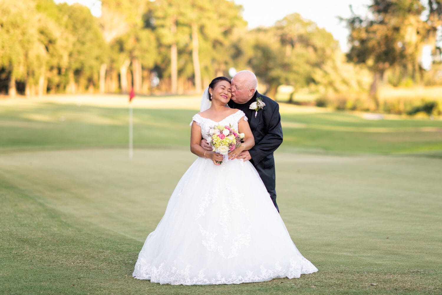 Senior couple getting married on the golf course - Pawleys Plantation