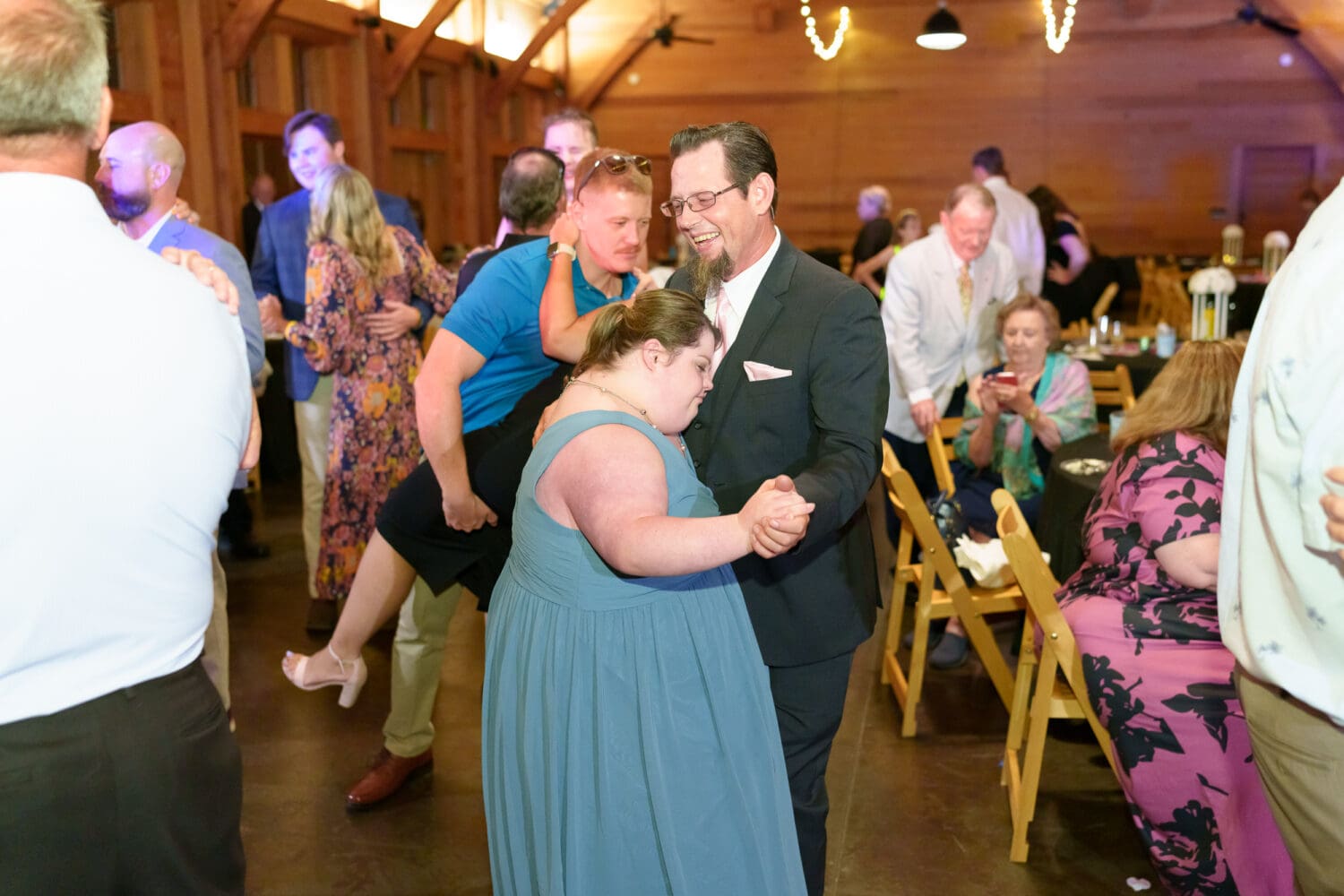 Bride's father and sister dancing - The Pavilion at Pepper Plantation