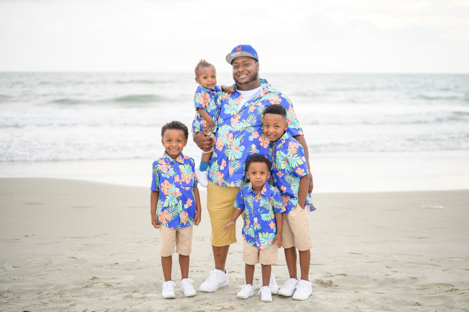 Happy family with 4 little boys on the beach - Huntington Beach State Park
