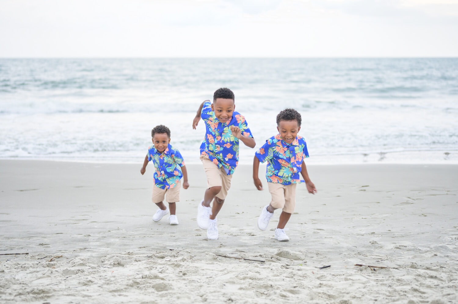 Happy family with 4 little boys on the beach - Huntington Beach State Park