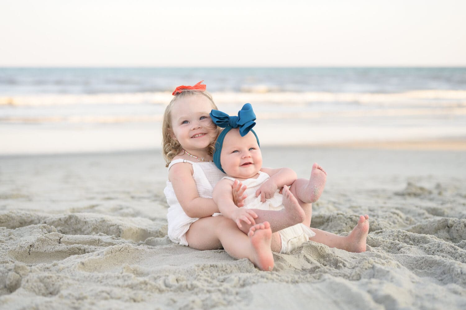 The cutest toddlers ever laying by the ocean - North Myrtle Beach