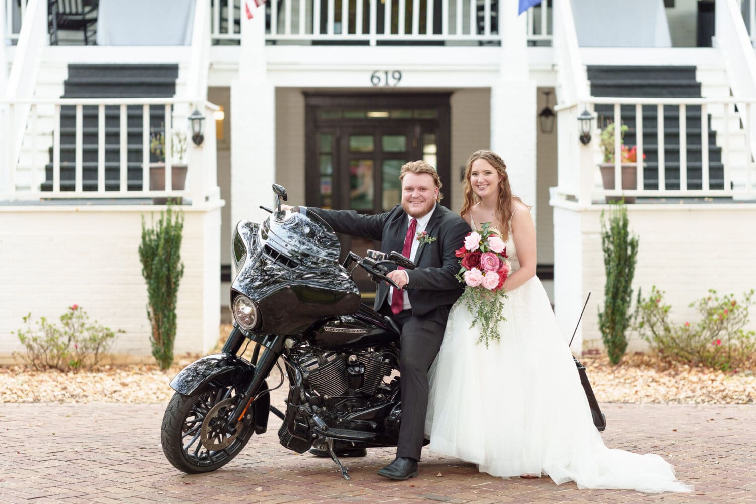 Bride and groom sitting on his Harley Davidson - Litchfield Country Club