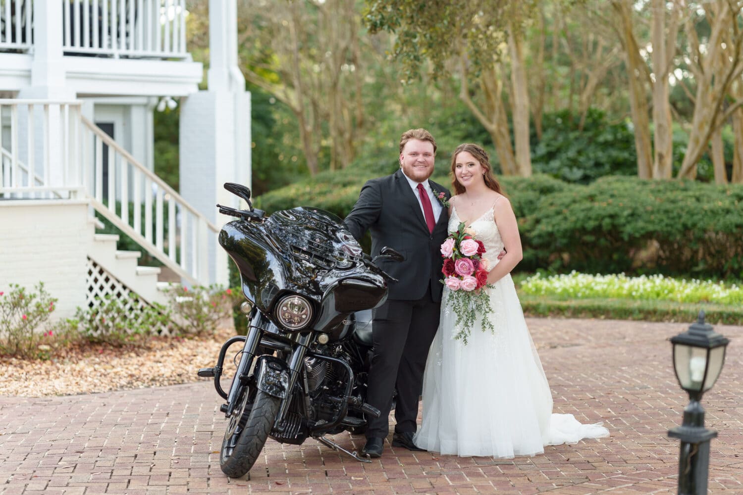 Bride and groom sitting on his Harley Davidson - Litchfield Country Club