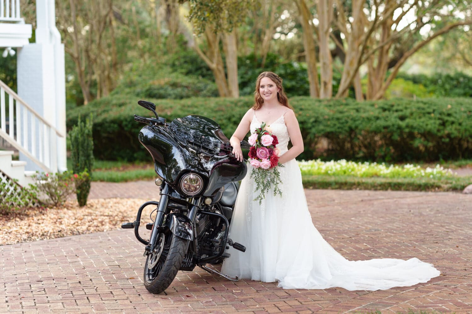 Bride posing by groom's Harley Davidson - Litchfield Country Club