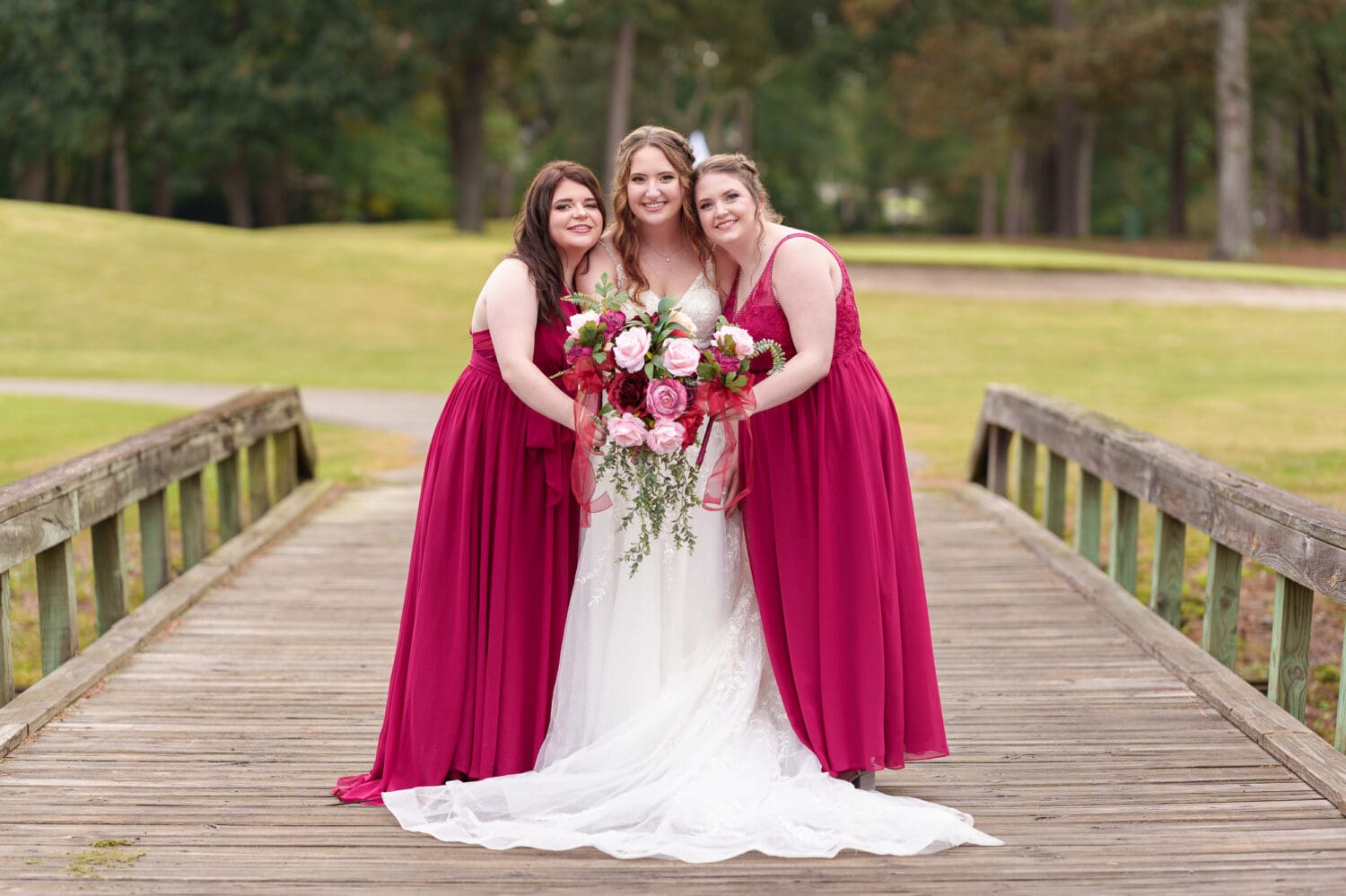 Bridesmaids holding flowers together - Litchfield Country Club
