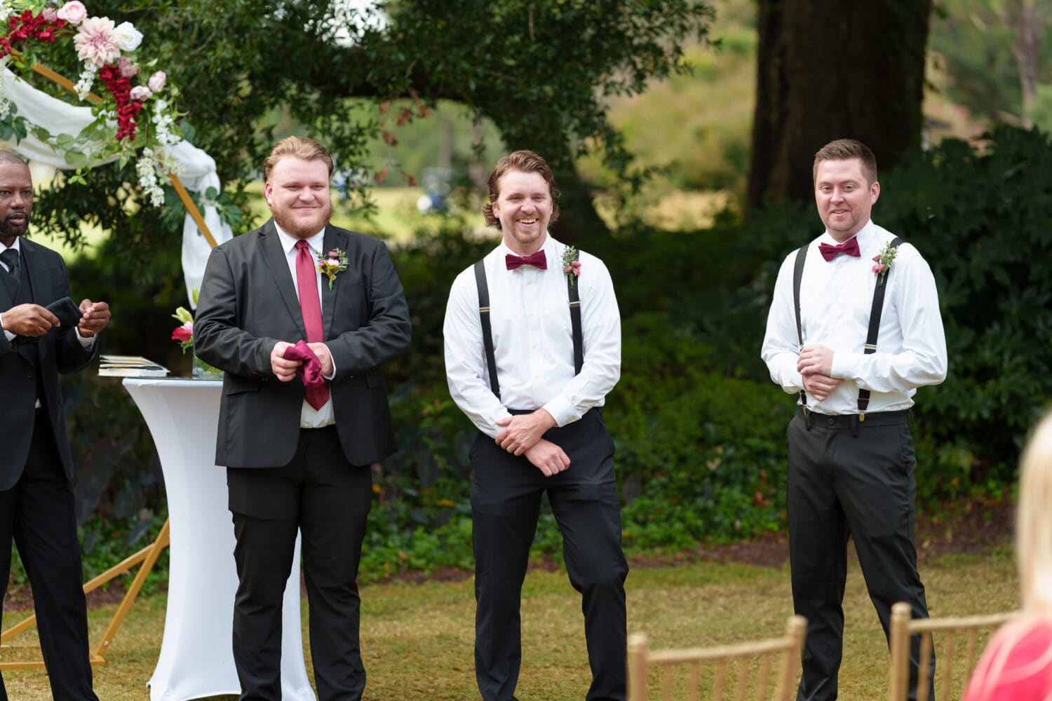Groom and groomsmen smiling at flowergirl - Litchfield Country Club