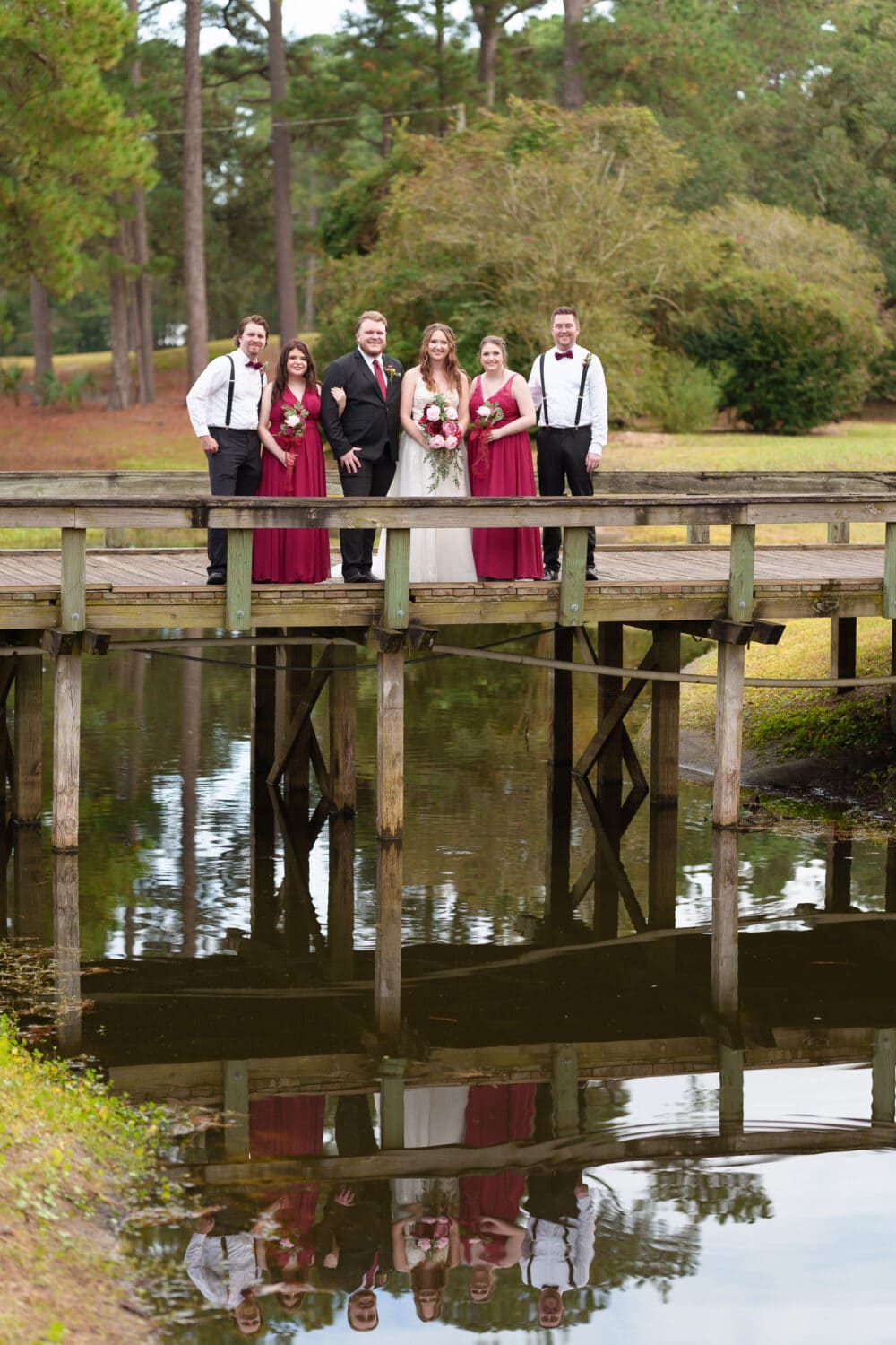 Wedding party reflecting in the water - Litchfield Country Club