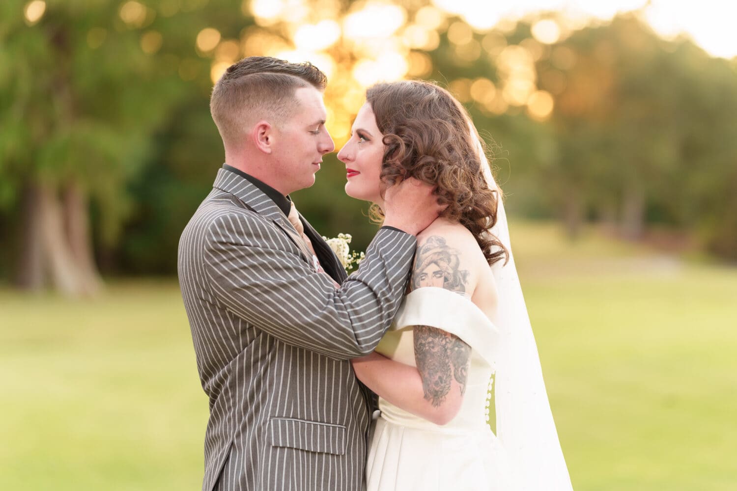 Beautiful bokeh from the sunset behind the bride and groom - Litchfield Country Club