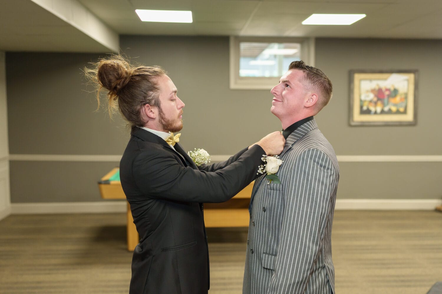 Best man helping groom with his tie - Litchfield Country Club