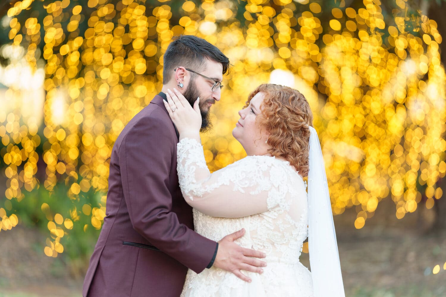 Bride and groom in front of the winter lights - Conway Riverwalk