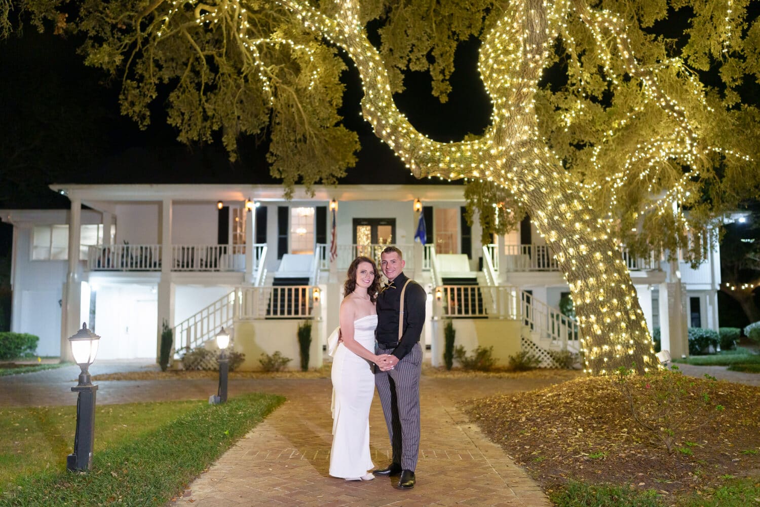 Bride and groom under the tree covered in winter lights - Litchfield Country Club