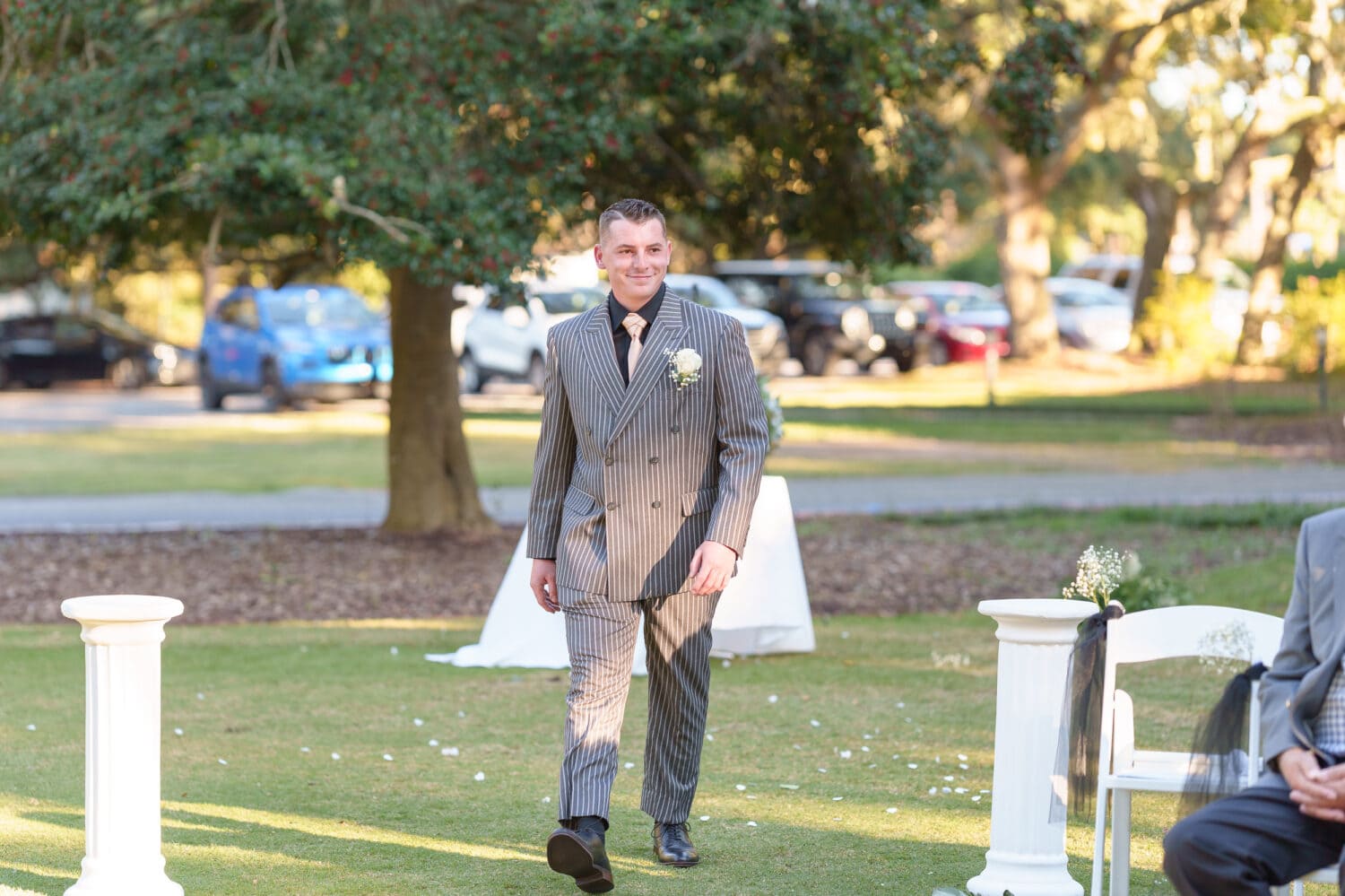 Groom walking to the ceremony - Litchfield Country Club