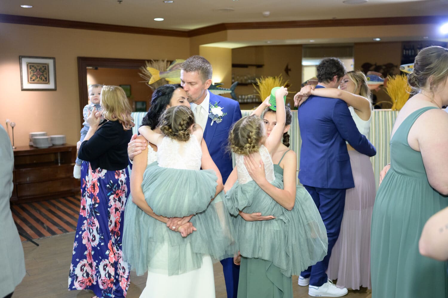 Groom dancing with his family - The Marina Inn