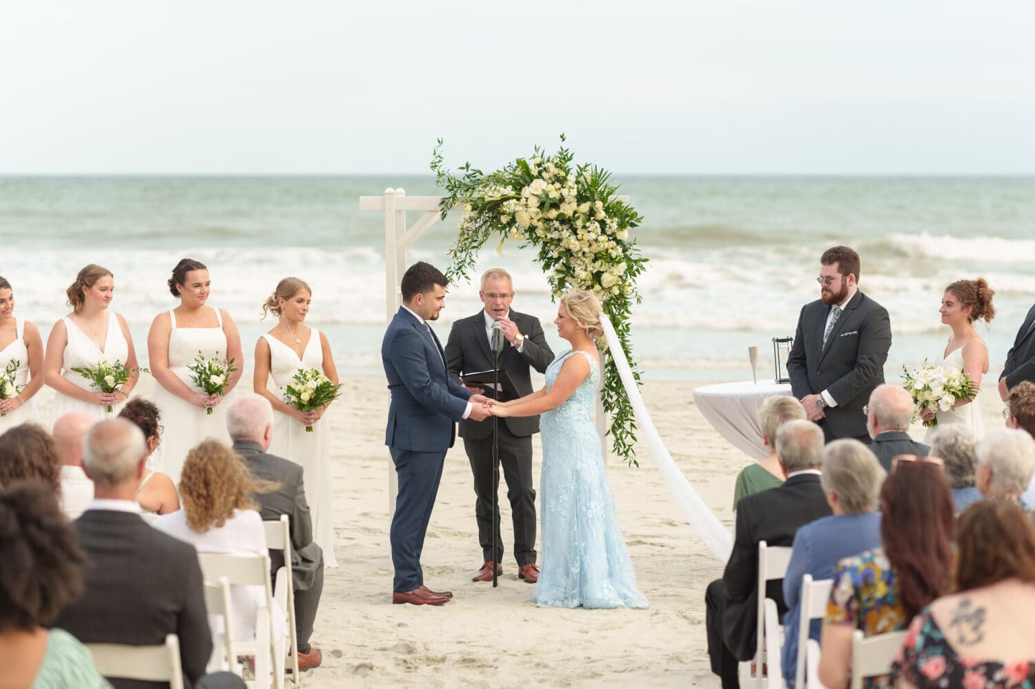 Holding hands during the ceremony - Hilton Myrtle Beach Resort